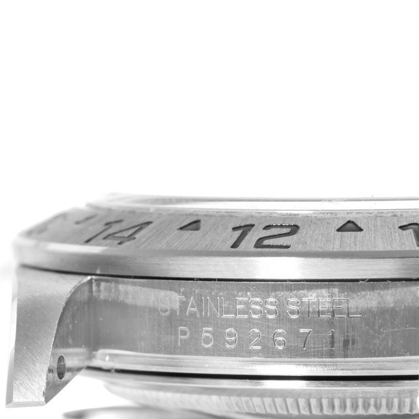 The image shows a close-up side view of the bezel, case, and part of the serial number of a Rolex Explorer 16570 Men's Stainless Steel White Dial 16570 Men's Stainless Steel White Dial watch.