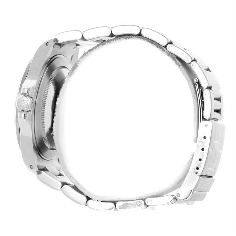 This side view of the Rolex Explorer 16570 Men's Stainless Steel White Dial 16570 Men's Stainless Steel White Dial watch highlights its stainless steel case, bracelet, and crown.