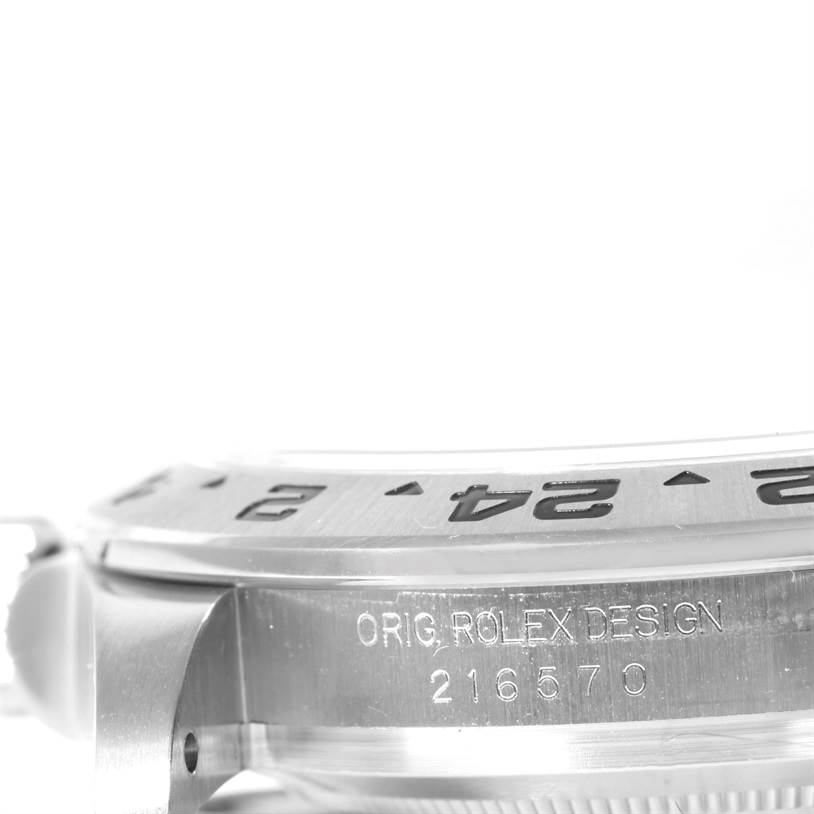 This image shows a close-up of the side case and part of the bezel of a Rolex Explorer 216570 Men's Stainless Steel White Dial 216570 Men's Stainless Steel White Dial watch, model number 216570.