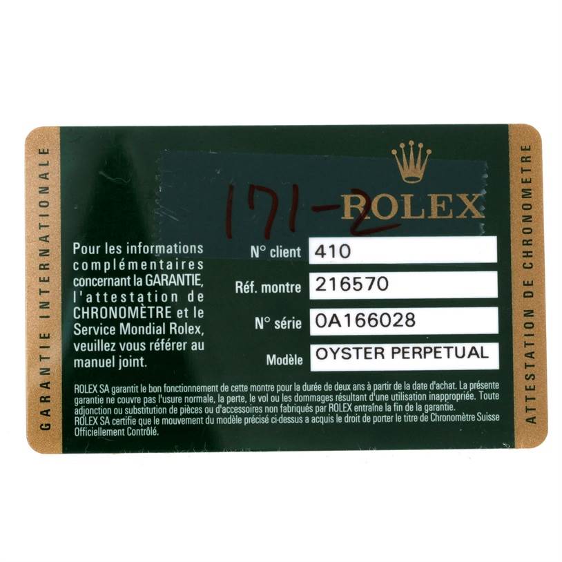 This image shows a Rolex warranty card for an Explorer model, including details like reference and serial numbers.