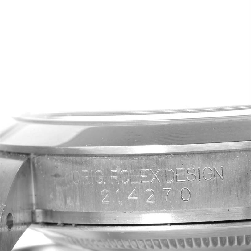 This is a close-up, angled shot of the side of a Rolex Explorer 214270 Men's Stainless Steel Black Dial 214270 Men's Stainless Steel Black Dial watch, showing the case with engraved text.