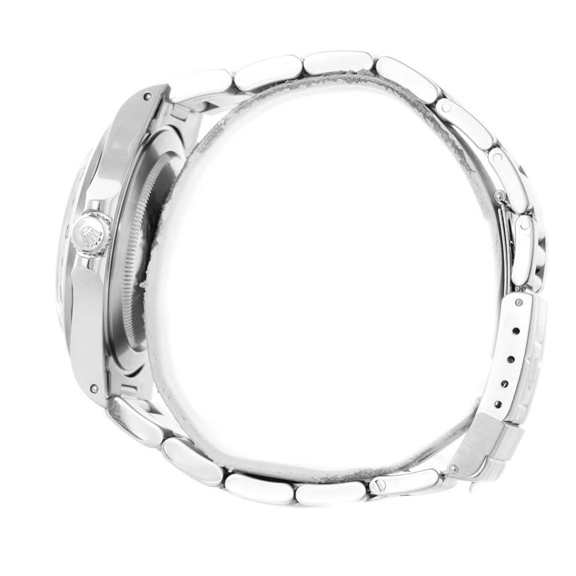 This side view of the Rolex Explorer 16570 Men's White Dial 16570 Men's White Dial watch shows the case, crown, and part of the bracelet with clasp.