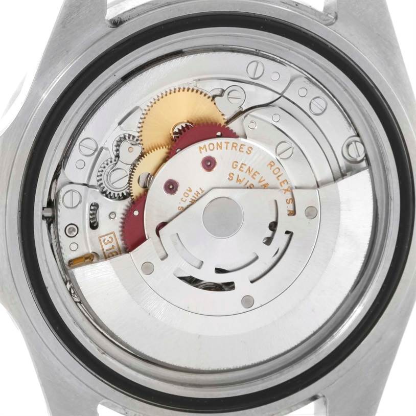 The image shows the internal mechanism of a Rolex Explorer 16570 Men's Stainless Steel White Dial 16570 Men's Stainless Steel White Dial watch, viewed from the back with the case removed.