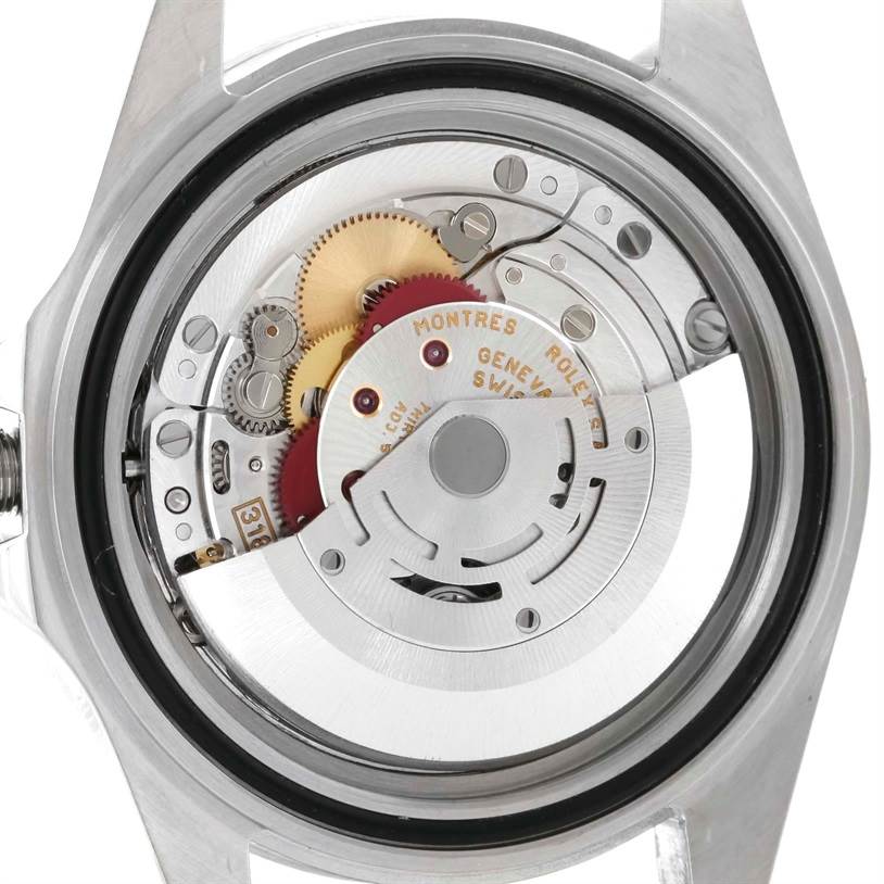The image shows the movement mechanism of a Rolex Explorer 16570 Men's Stainless Steel White Dial 16570 Men's Stainless Steel White Dial from the back case angle, highlighting gears and internal components.