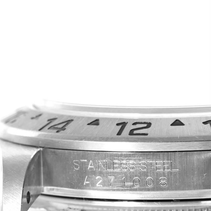 The image shows a close-up side view of the stainless steel bezel and part of the case of a Rolex Explorer 16570 Men's Stainless Steel White Dial 16570 Men's Stainless Steel White Dial watch.