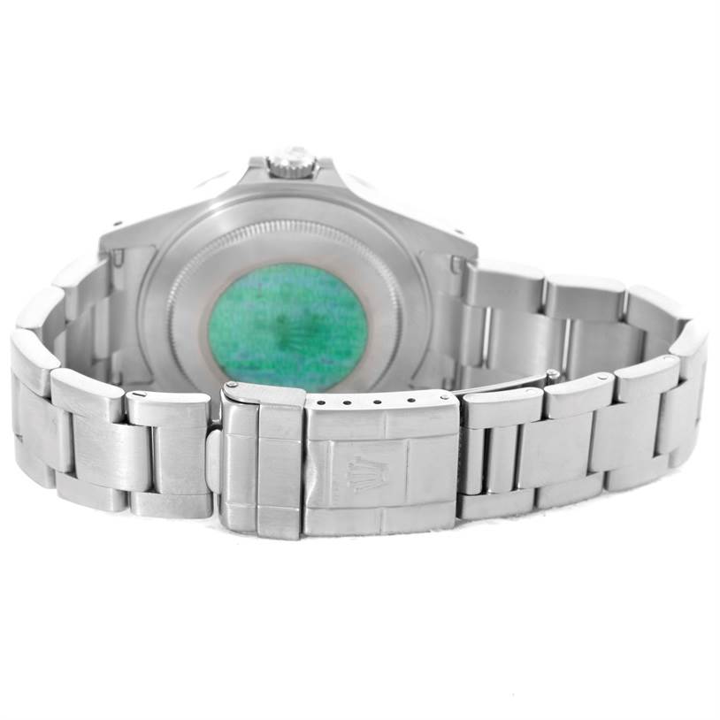 The image shows the back view of a Rolex Explorer 16570 Men
s Stainless Steel White Dial 16570 Men
s Stainless Steel White Dial model, including the case back and the bracelet clasp.