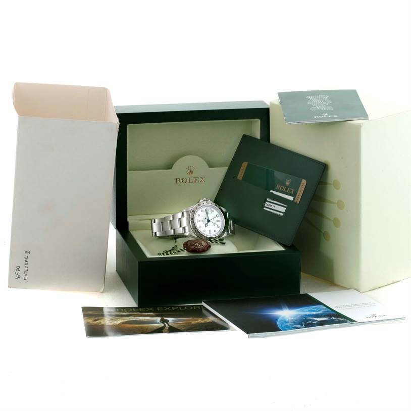 The image shows a Rolex Explorer 16570 Men's Stainless Steel White Dial 16570 Men's Stainless Steel White Dial watch in its box, accompanied by Rolex documentation and packaging materials.