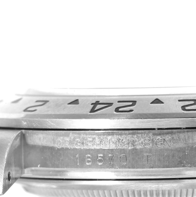 This image shows a close-up angle of the bezel and the edge of the case of a Rolex Explorer 16570 Men's Stainless Steel White Dial 16570 Men's Stainless Steel White Dial model watch, displaying the model number.