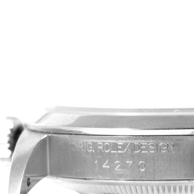 The image shows a side view of the case of a Rolex Explorer 14270 Men's Stainless Steel Black Dial 14270 Men's Stainless Steel Black Dial model, displaying engravings with the design number.