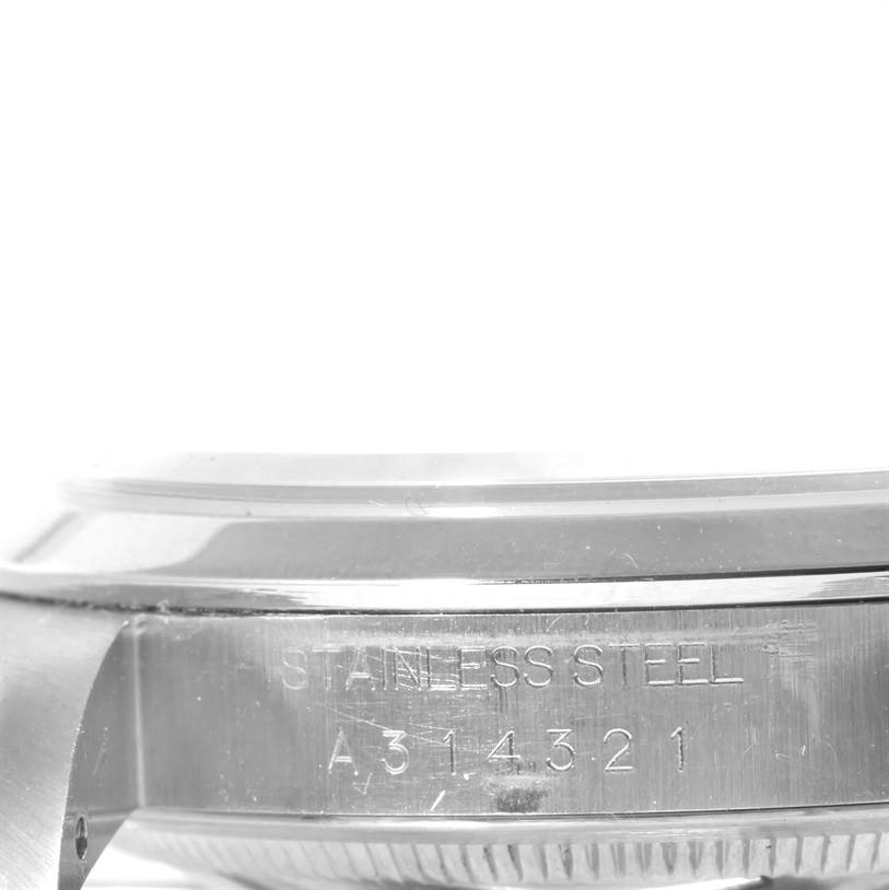 This image shows a side view of the stainless steel case back of a Rolex Explorer 14270 Men's Stainless Steel Black Dial 14270 Men's Stainless Steel Black Dial watch with model number.