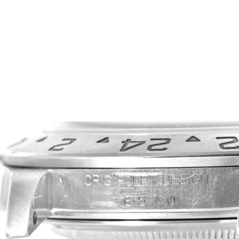 The image shows a side view of the bezel and case of a Rolex Explorer 16570 Men
s Stainless Steel White Dial 16570 Men
s Stainless Steel White Dial model, including the model number 16570 engraved.