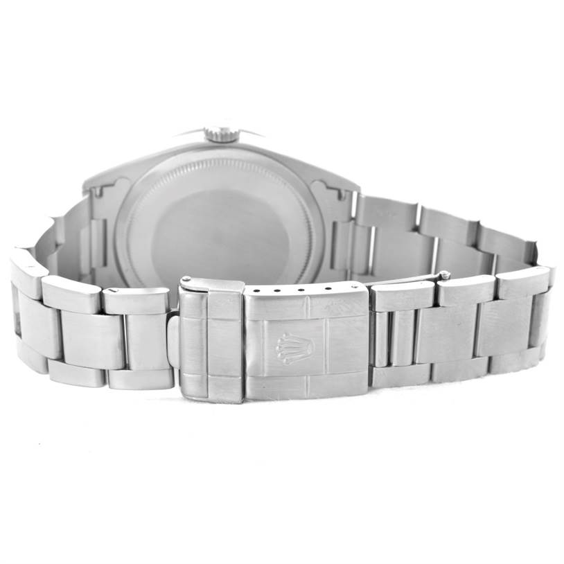 This image shows the back view of a Rolex Explorer 14270 Men's Stainless Steel Black Dial 14270 Men's Stainless Steel Black Dial watch, highlighting the case back and clasp of the metal bracelet.