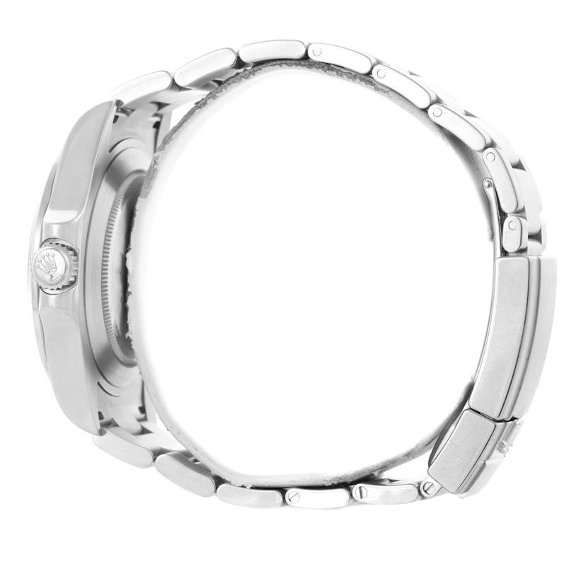 This side view of the Rolex Explorer 216570 Men's Stainless Steel White Dial 216570 Men's Stainless Steel White Dial model shows the bracelet, clasp, watch case, and crown.