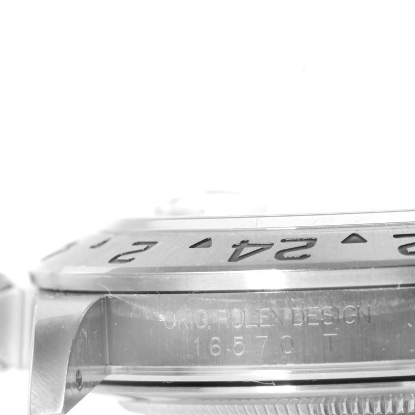 The image shows a side-angle view of the bezel and case of a Rolex Explorer 16570 Men
s Stainless Steel White Dial 16570 Men
s Stainless Steel White Dial watch, with model number 16570 clearly engraved.