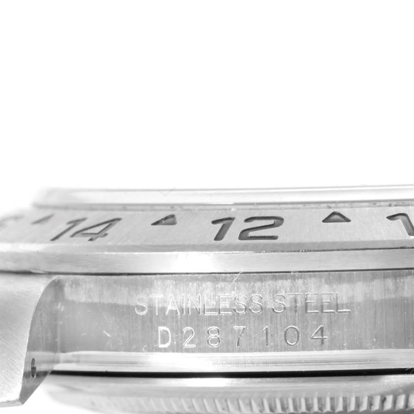 This image shows a close-up of the side of a Rolex Explorer 16570 Men's Stainless Steel White Dial 16570 Men's Stainless Steel White Dial watch, highlighting the engravings on its stainless steel bezel and case.
