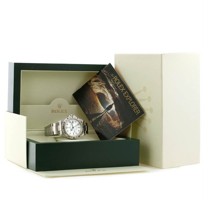 The image shows a Rolex Explorer 16570 Men's Stainless Steel White Dial 16570 Men's Stainless Steel White Dial watch from an elevated angle, placed in its box along with its booklet.