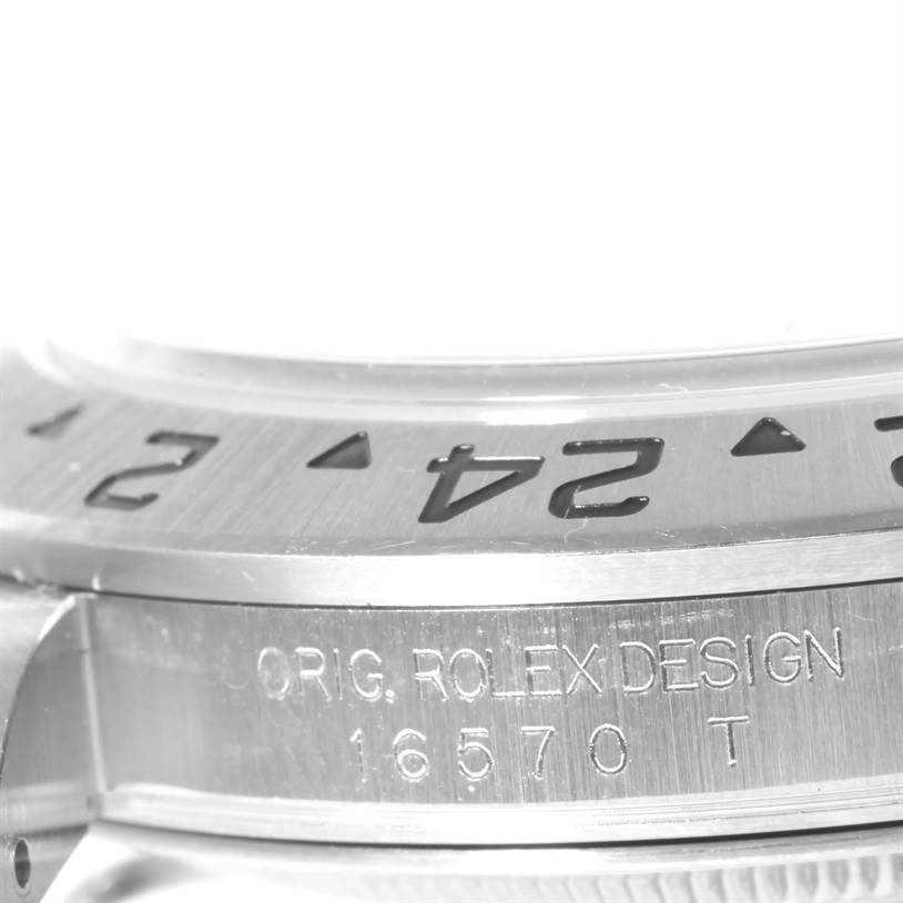 The image shows a close-up of the bezel and case side with engravings of the Rolex Explorer 16570 Men's Stainless Steel White Dial 16570 Men's Stainless Steel White Dial model.