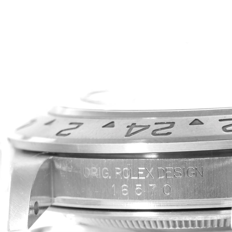 The image shows a close-up of the side of a Rolex Explorer 16570 Men's Stainless Steel White Dial 16570 Men's Stainless Steel White Dial watch, focusing on the bezel and case with the model number 16570 engraved.