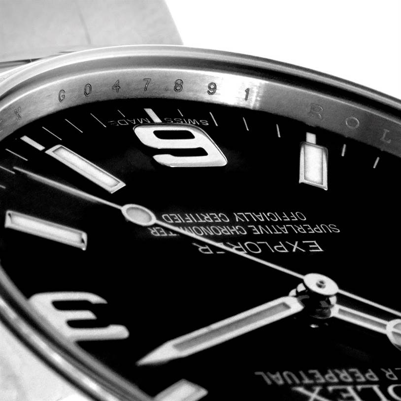 The close-up angle shows the dial, hands, and part of the bezel of the Rolex Explorer 214270 Men's Stainless Steel Black Dial 214270 Men's Stainless Steel Black Dial watch.