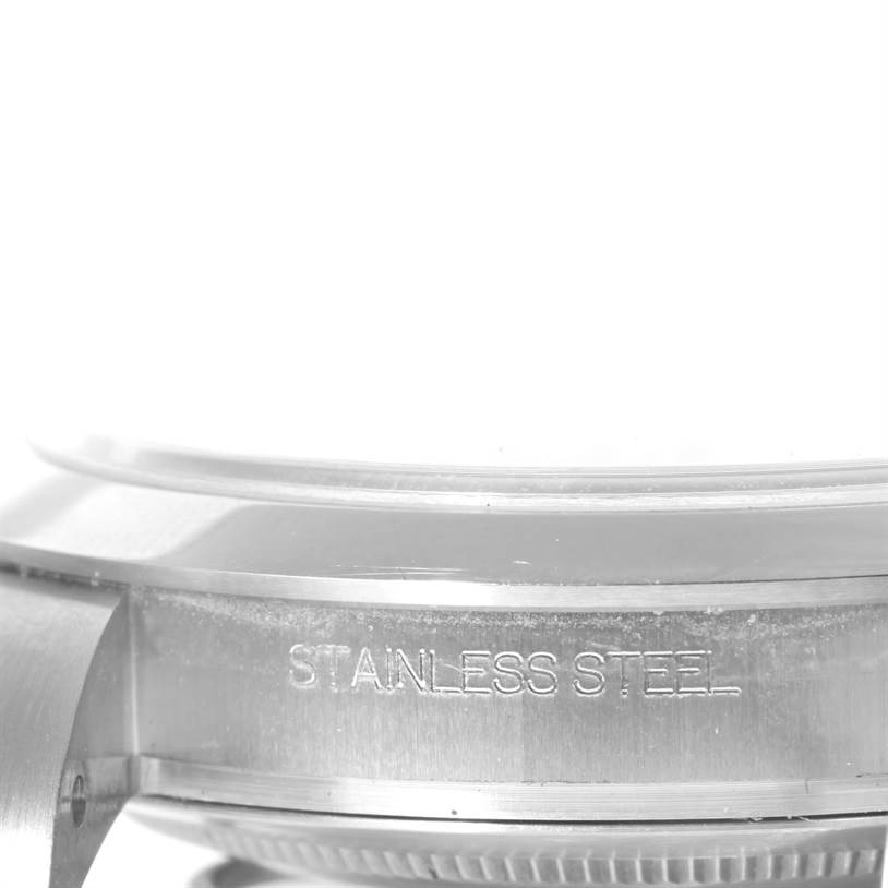This close-up image shows the side engraving "STAINLESS STEEL" on the case of a Rolex Explorer 214270 Men's Stainless Steel Black Dial 214270 Men's Stainless Steel Black Dial watch.