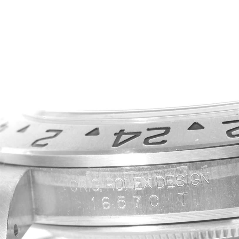 The image shows a close-up angle of the bezel and case side of a Rolex Explorer 16570 Men's Stainless Steel White Dial 16570 Men's Stainless Steel White Dial watch with the model number 16570 T engraved.