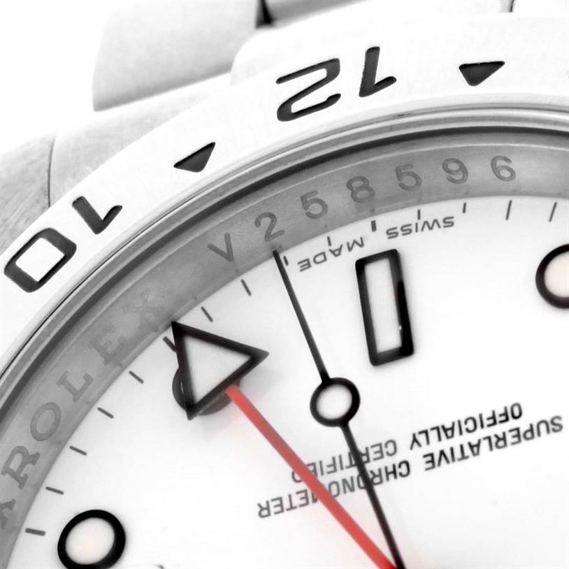 Close-up of the Rolex Explorer 16570 Men's Stainless Steel White Dial 16570 Men's Stainless Steel White Dial watch showing the bezel, part of the dial, and a section of the bracelet.