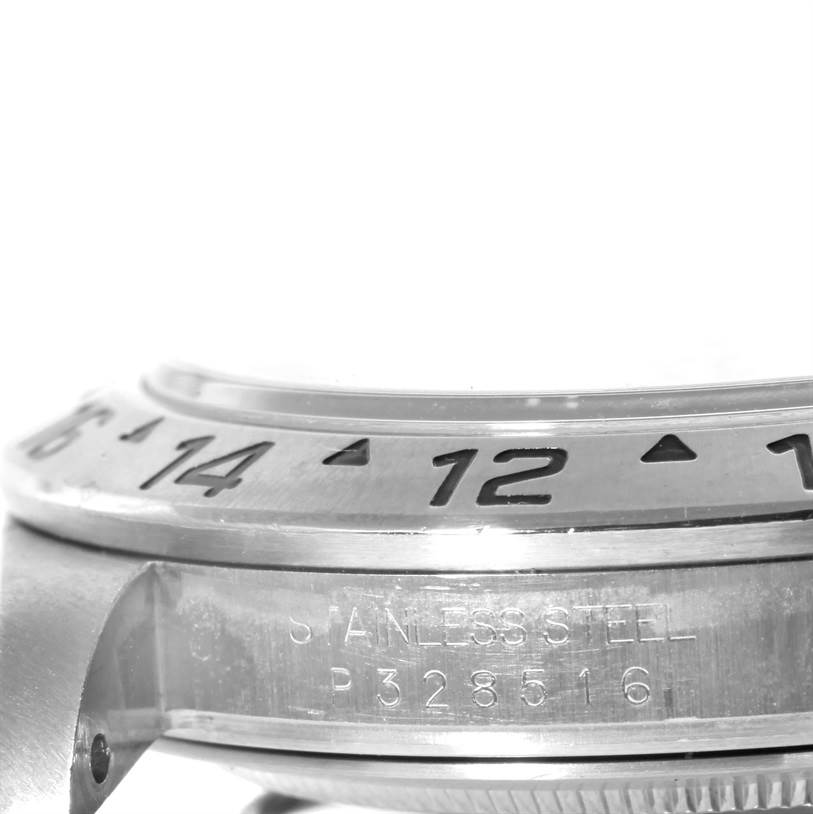 The image shows a close-up side view of the stainless steel bezel and part of the case of the Rolex Explorer 16570 Men's Stainless Steel White Dial 16570 Men's Stainless Steel White Dial model.