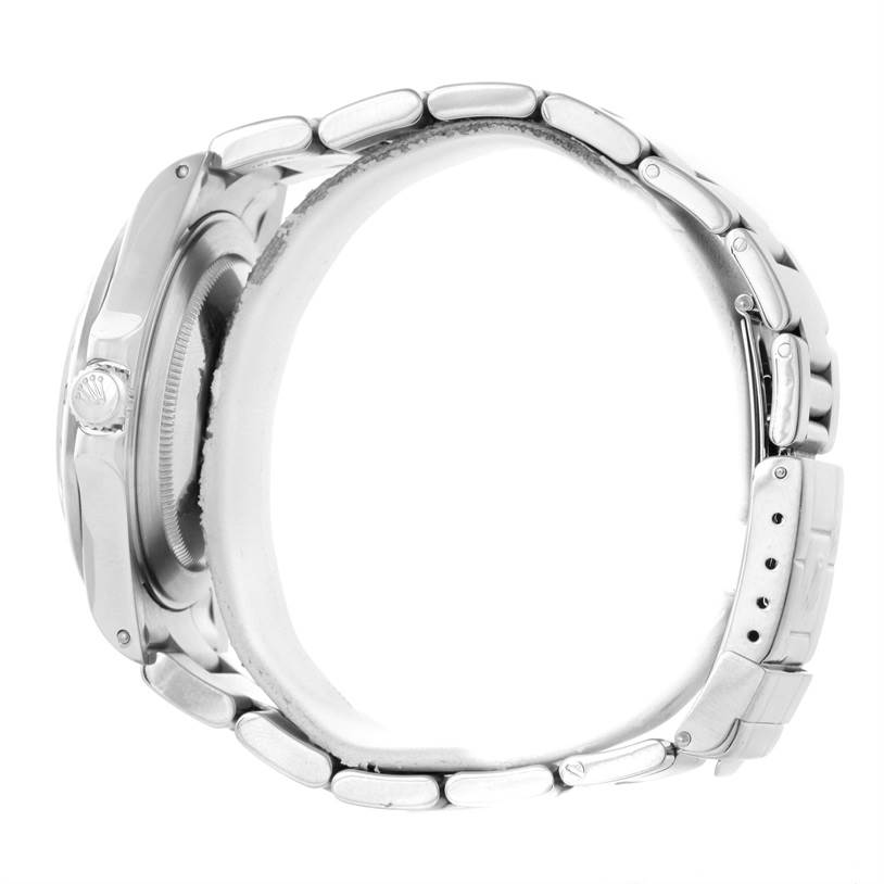 The image shows a side profile of the Rolex Explorer 16570 Men's Stainless Steel White Dial 16570 Men's Stainless Steel White Dial model, focusing on the watch case, crown, and metal bracelet.