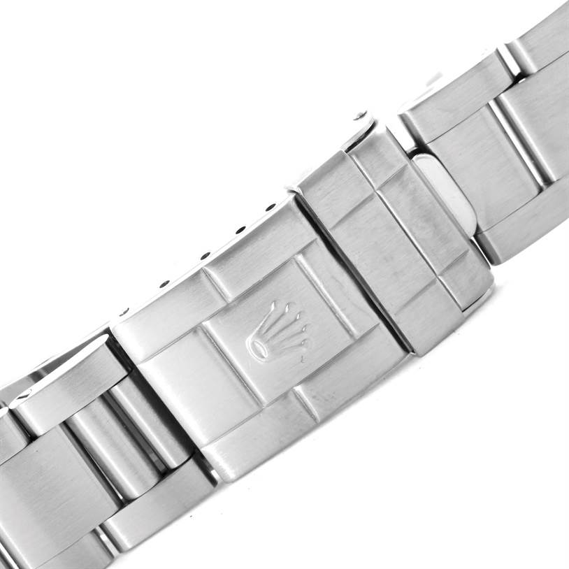 This is a close-up shot of the bracelet and clasp of the Rolex Explorer 16570 Men's Stainless Steel White Dial 16570 Men's Stainless Steel White Dial watch, focusing on the Rolex logo on the clasp.