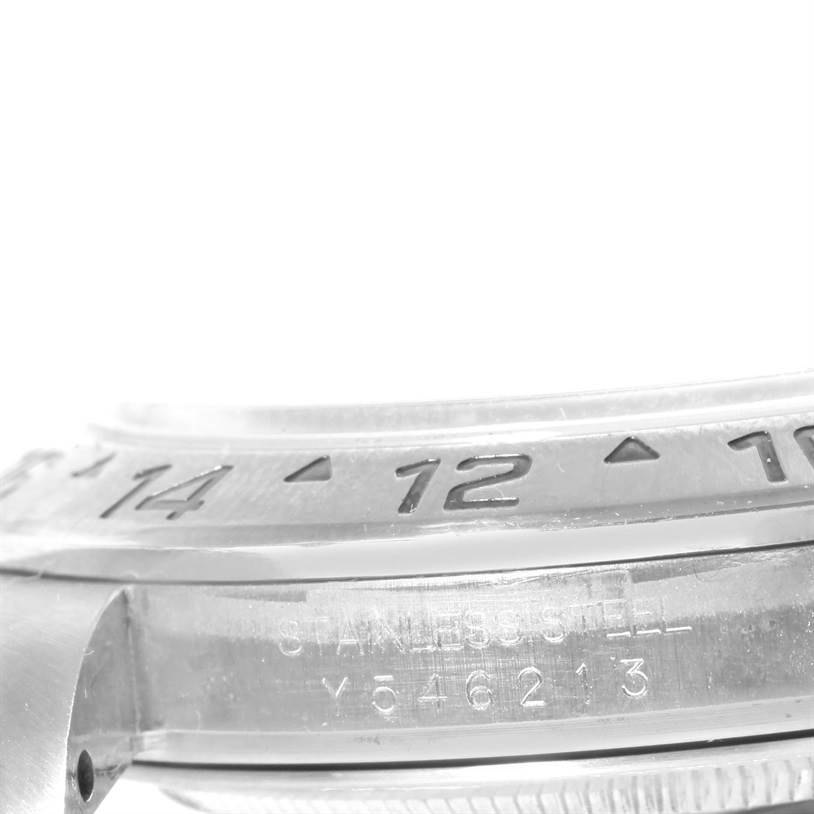 The image shows a close-up side view of the bezel and case of a Rolex Explorer 16570 Men's Stainless Steel White Dial 16570 Men's Stainless Steel White Dial watch, including the engraved serial number.