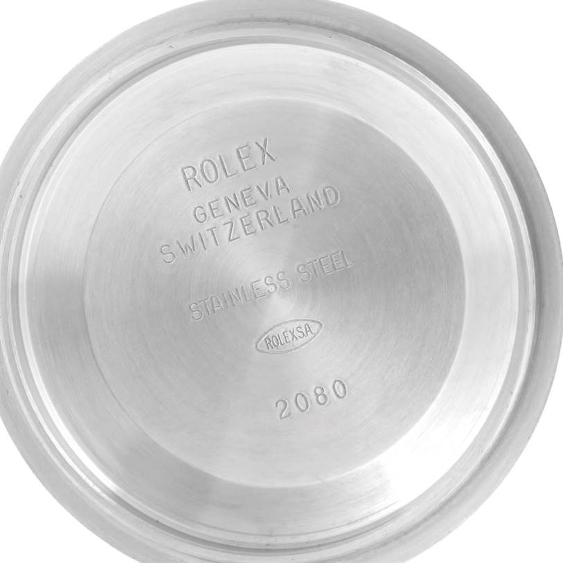 This image shows the interior side of the case back of a Rolex Explorer 114270 Men's Stainless Steel Black Dial 114270 Men's Stainless Steel Black Dial watch, highlighting engravings indicating brand, origin, and material.