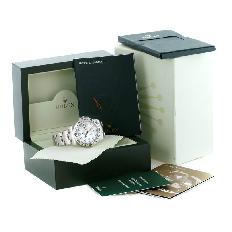 The image shows a Rolex Explorer 216570 Men's Stainless Steel White Dial 216570 Men's Stainless Steel White Dial watch in an open box with accompanying booklets and warranty cards.