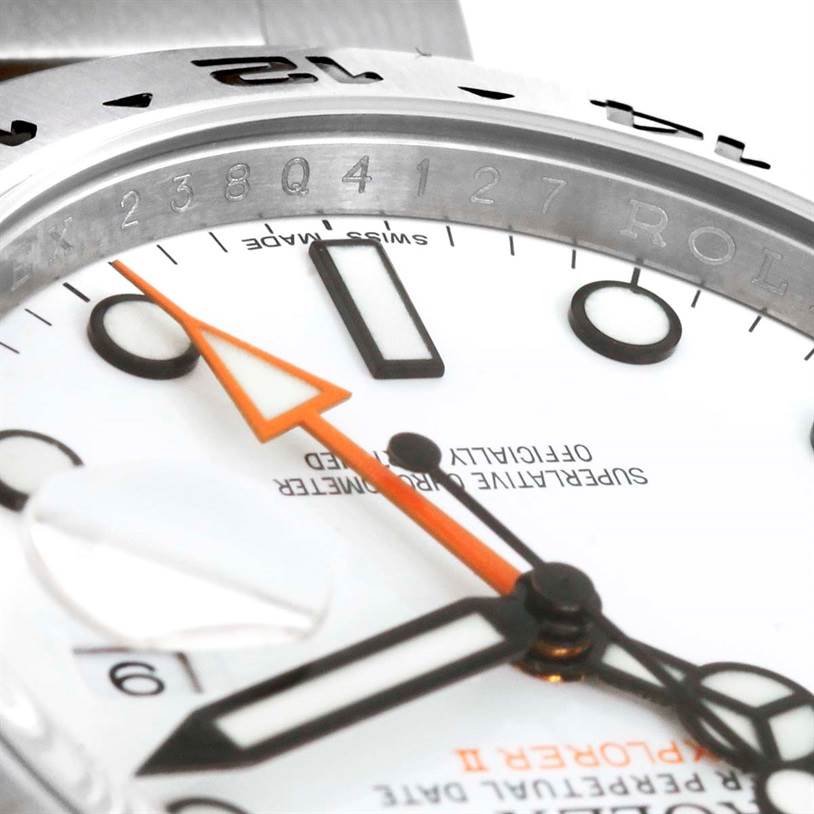 The image shows a close-up of a Rolex Explorer 216570 Men's Stainless Steel White Dial 216570 Men's Stainless Steel White Dial watch, focusing on the face, bezel, and orange hour hand.