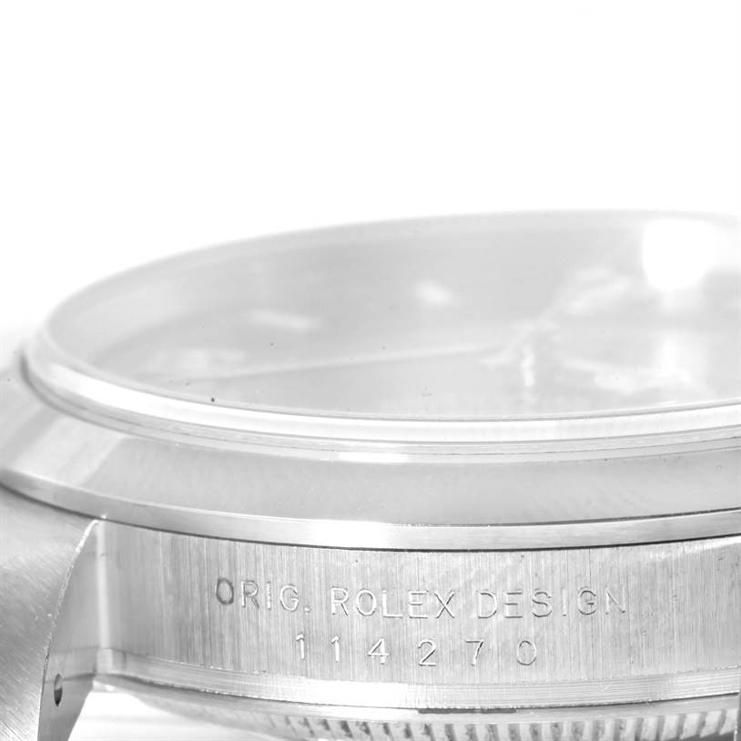 The image shows a side view of the case and bezel of a Rolex Explorer 114270 Men's Stainless Steel Black Dial 114270 Men's Stainless Steel Black Dial watch, with the model number 114270 engraved.