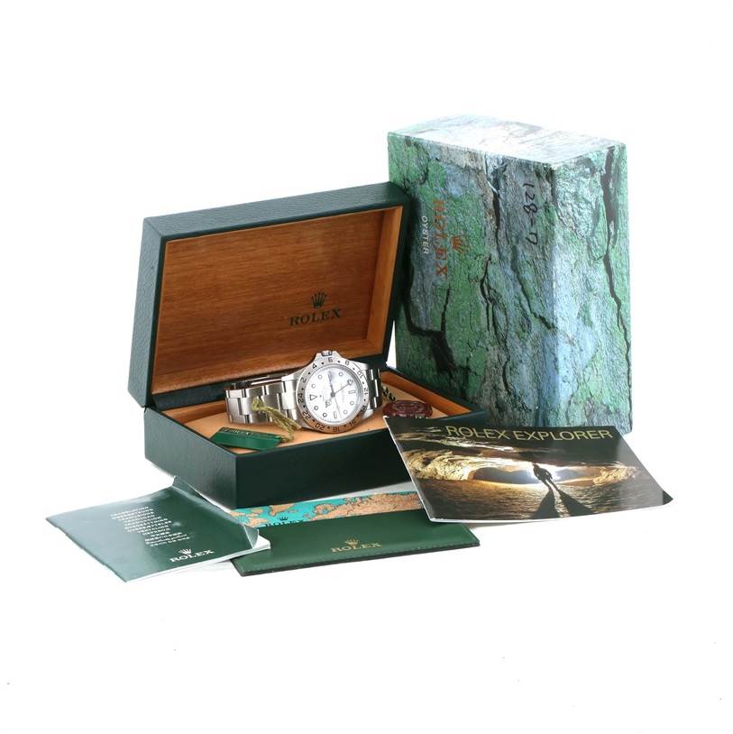 The image shows a Rolex Explorer 16570 Men's Stainless Steel White Dial 16570 Men's Stainless Steel White Dial model watch at an angle in its open box, with accompanying booklets and packaging.
