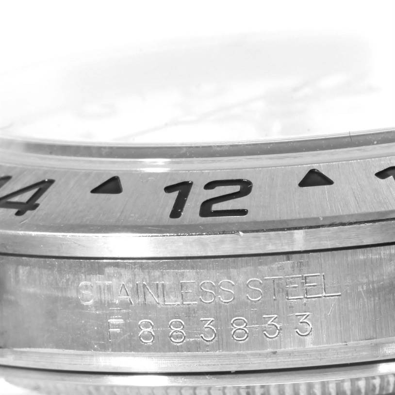 The image shows a close-up of the bezel and side casing of the stainless steel Rolex Explorer 16570 Men's Stainless Steel White Dial 16570 Men's Stainless Steel White Dial.