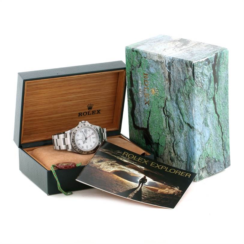 This image shows a Rolex Explorer 16570 Men's Stainless Steel White Dial 16570 Men's Stainless Steel White Dial watch with its box, packaging, and booklet at an angle that displays the watch face and bracelet.
