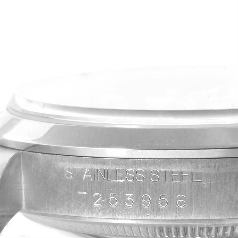 The image shows the side view of a stainless steel Rolex Explorer 14270 Men's Stainless Steel Black Dial 14270 Men's Stainless Steel Black Dial watch case, featuring engraved serial numbers.