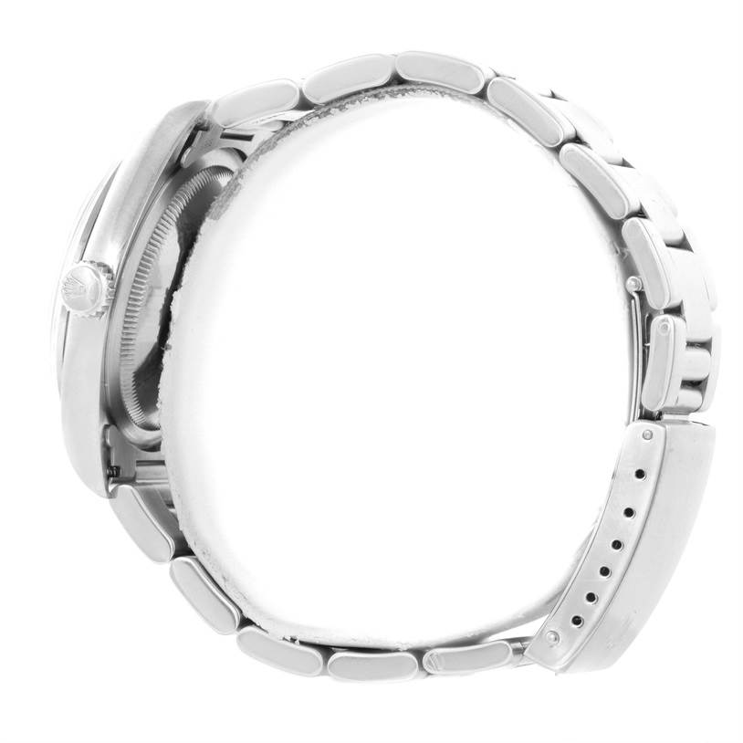 The image shows a side profile of the Rolex Explorer 14270 Men's Stainless Steel Black Dial 14270 Men's Stainless Steel Black Dial watch, highlighting the band, clasp, and part of the crown.