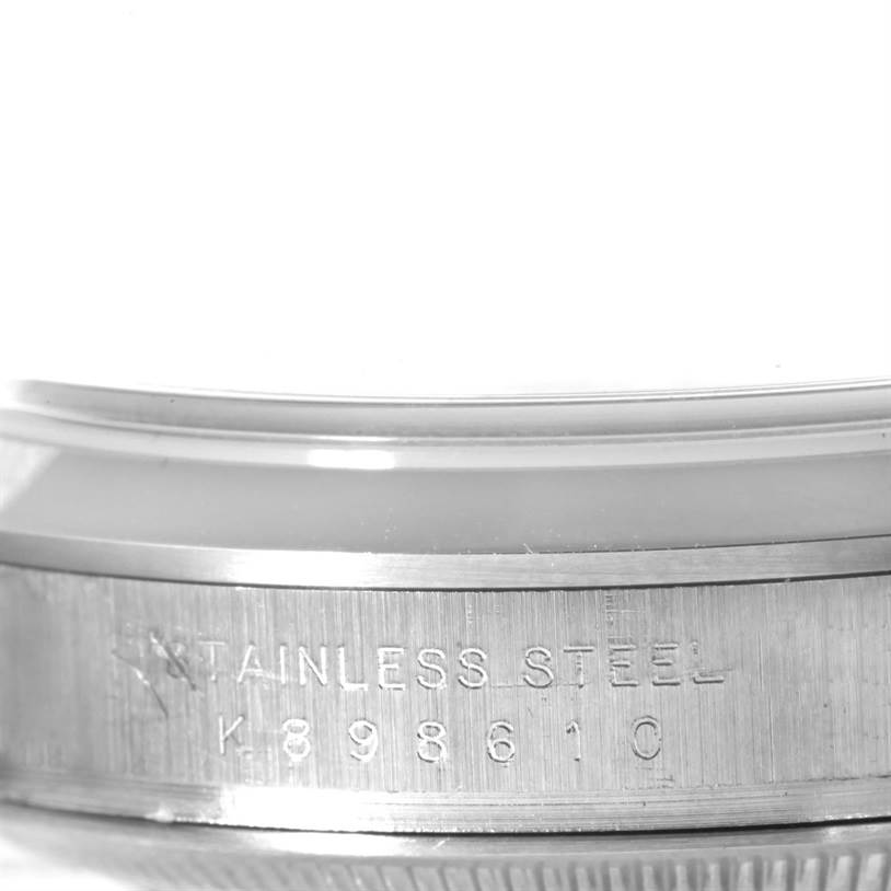 This image shows a close-up of the serial number and "Stainless Steel" engraving on the side of a Rolex Explorer 114270 Men's Stainless Steel Black Dial 114270 Men's Stainless Steel Black Dial watch case.