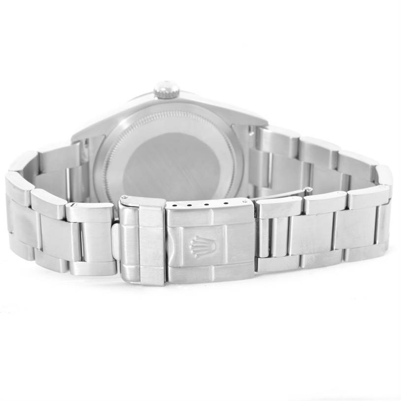 A Rolex Explorer 114270 Men's Stainless Steel Black Dial 114270 Men's Stainless Steel Black Dial watch is shown from the back, highlighting its case and bracelet with the clasp visible.