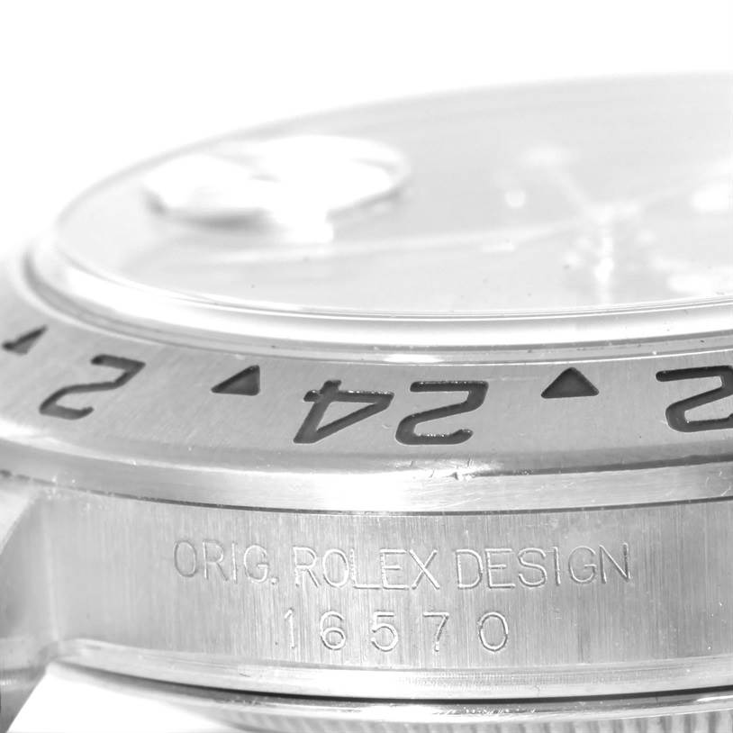 The image shows a close-up of the bezel and case side of a Rolex Explorer 16570 Men's Stainless Steel Black Dial 16570 Men's Stainless Steel Black Dial watch, highlighting the engraved model number 16570.