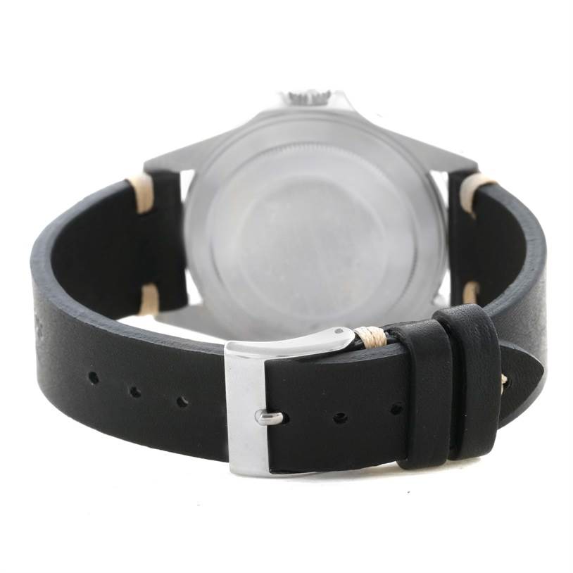 This image shows the back view of a Rolex Explorer 16570 Men's Stainless Steel Black Dial 16570 Men's Stainless Steel Black Dial watch with a leather strap and buckle.