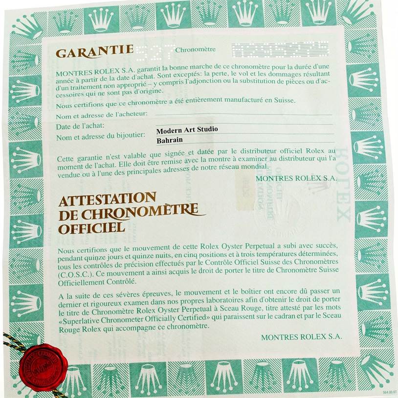 The image shows a close-up of the guarantee certificate for the Rolex Explorer 16570 Men
s Stainless Steel Black Dial 16570 Men
s Stainless Steel Black Dial model, including warranty details and jeweler information.