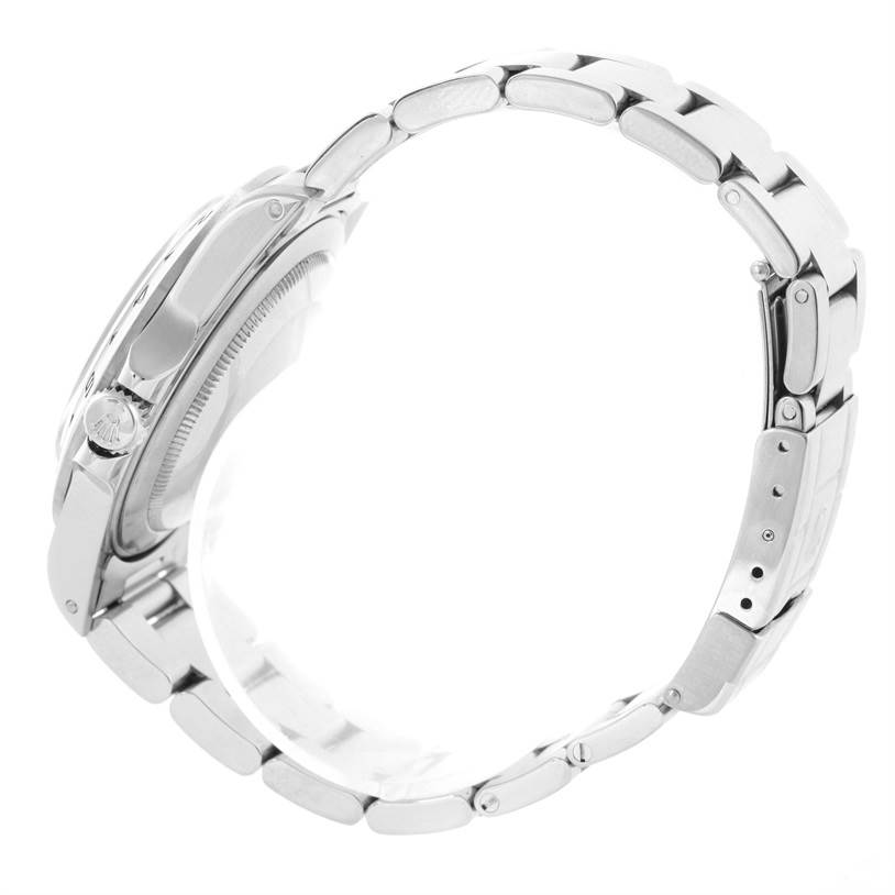 This side-angle view of the Rolex Explorer 16570 Men
s Stainless Steel Black Dial 16570 Men
s Stainless Steel Black Dial watch showcases its band, case, and the crown.