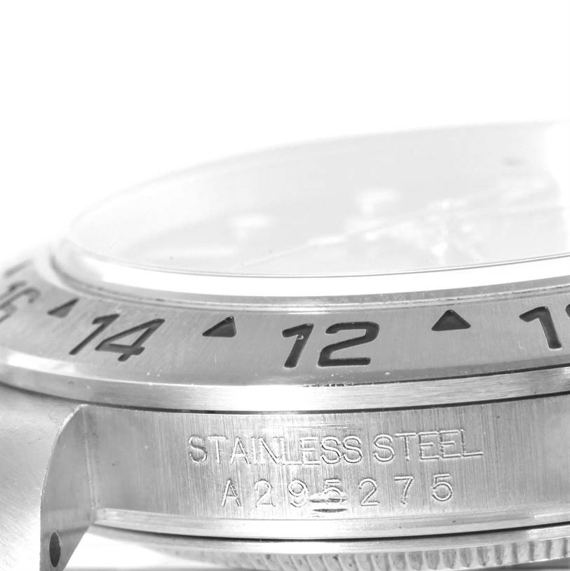 This close-up angle shows the side of the Rolex Explorer 16570 Men
s Stainless Steel Black Dial 16570 Men
s Stainless Steel Black Dial watch, emphasizing the bezel and the stainless steel serial number engraving.