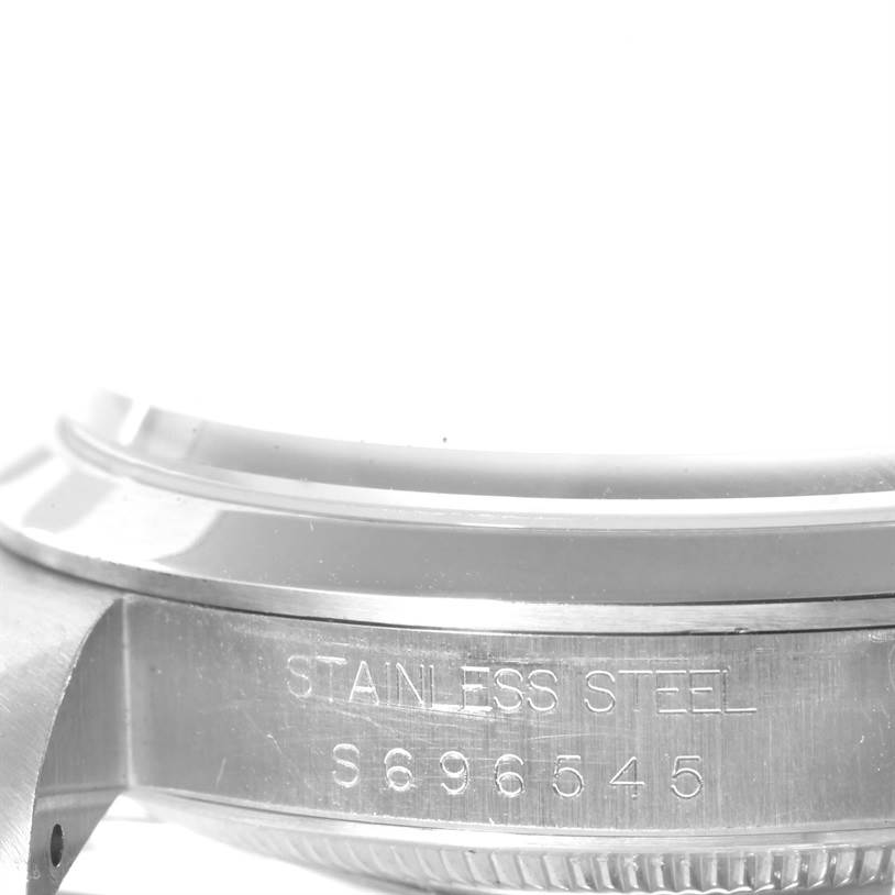 The image shows a close-up side angle of the stainless steel case of a Rolex Explorer 14270 Men's Stainless Steel Black Dial 14270 Men's Stainless Steel Black Dial watch.