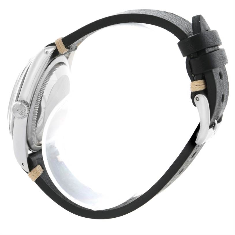 This side view shows the case, crown, bezel, and black leather strap of the Rolex Explorer 14270 Men's Stainless Steel Black Dial 14270 Men's Stainless Steel Black Dial watch.