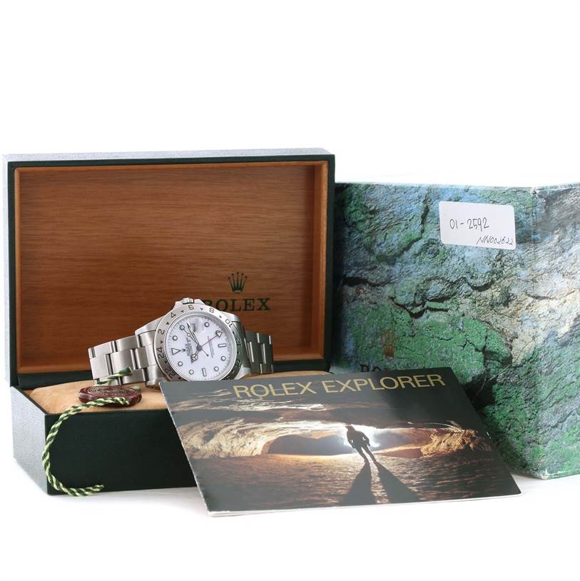 The image shows a Rolex Explorer 16570 Men's Stainless Steel White Dial 16570 Men's Stainless Steel White Dial watch with its box, booklet, and tags, positioned at an oblique angle.
