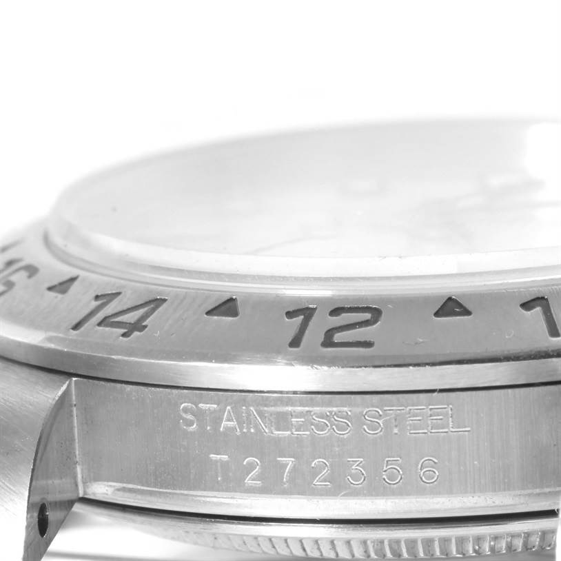 The image shows a close-up side angle of the bezel and case with the serial number of the Rolex Explorer 16570 Men's Stainless Steel White Dial 16570 Men's Stainless Steel White Dial watch.
